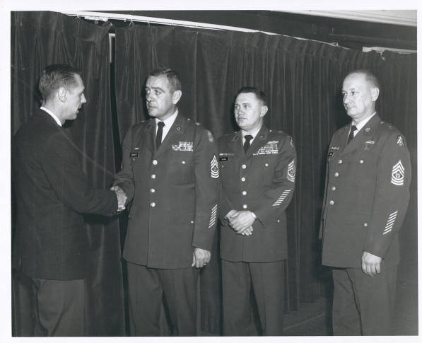 Command Sergeant Major Francis J. Bennett – Sergeant First Class John W. Murphey (L), Secretary – Custodian, Noncommissioned Officers Open Mess, Fort Sheridan, greets Command Sergeant Major Francis J. Bennett (2d left), CSM, United States Continental Army Command. Escorting CSM Bennett to the luncheon held in his honor are: Command Sergeant Major Farrell C. Graham, (2d right) CSM, Fifth U.S. Army; and Command Sergeant Major D.J. Quinn (right), CSM, Fort Sheridan.